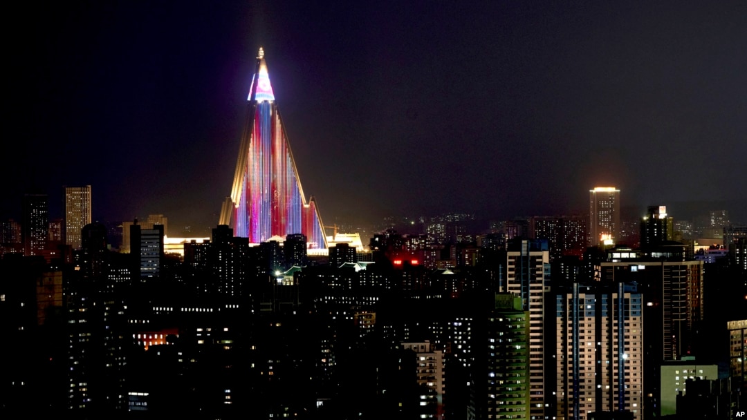 The Ryugyong Hotel is illuminated in the night sky in Pyongyang, North Korea, Sept. 6, 2018, days before the 70th anniversary of the founding of North Korea. 
