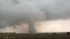 A tornado spins during stormy weather in Mangum, Okla., May 20, 2019. 