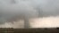 A tornado spins during stormy weather in Mangum, Okla., May 20, 2019. 