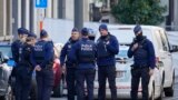 FILE — Belgian Police patrol behind a cordoned off area close to where a suspected Tunisian extremist has been shot dead hours after manhunt looking for him, Oct. 17, 2023. 