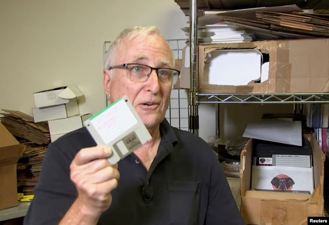 Tom Persky, the owner of floppydisk.com and disk trader, shows off a computer disk at his warehouse in Lake Forest, California, U.S., October 6, 2022 in this screengrab from a Reuters TV video. (REUTERS/Alan Devall)