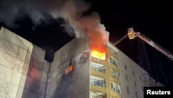 Rescuers work at the site of a residential building damaged during a Russian drone strike, amid Russia's attack on Ukraine, in the town of Dolynska, in Kirovohrad region, Ukraine, Feb. 18, 2025. 