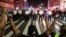 Protesters take a knee on Flatbush Avenue in front of New York City police officers during a solidarity rally for George Floyd, Thursday, June 4, 2020, in the Brooklyn borough of New York. Floyd died after being restrained by Minneapolis police…