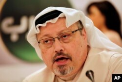 FILE - Saudi journalist Jamal Khashoggi speaks during a press conference in Manama, Bahrain, Feb. 1, 2015.