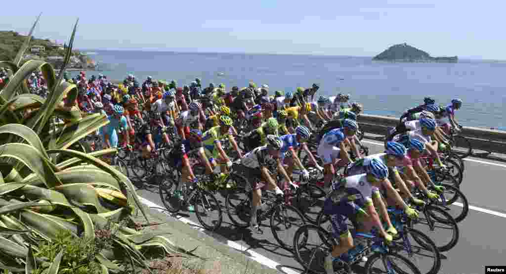 A pack of riders competes during the 177-kilometer (109-mile) second stage of the 98th Giro d&#39;Italia (Tour of Italy ) cycling race from Albenga to Genoa, Italy.