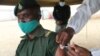 A prison official being vaccinated at Chikurubi Maximum Prison in Harare in October 2021 (VOA/Columbus Mavhunga)