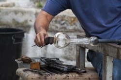 Glassblower working on a piece