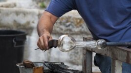 Glassblower working on a piece