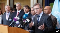 U.N. representative for Libya, Bernardino Leon, right, addresses reporters while Libyan parliaments members listen in Rabat, Morocco, Sept. 18, 2015. 