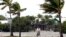 A cyclist rides his bike in Key West, Florida, Sunday, Aug. 26, 2012. Tropical Storm Isaac gained fresh muscle Sunday as it bore down on the Florida Keys, with forecasters warning it could grow into a dangerous Category 2 hurricane as it nears the norther