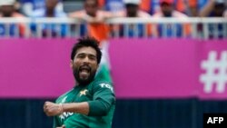 Pakistan's Mohammad Amir celebrates after taking a wicket during the ICC men's Twenty20 World Cup 2024 group A cricket match between India and Pakistan at Nassau County International Cricket Stadium in East Meadow, New York on June 9, 2024. (Photo by TIM