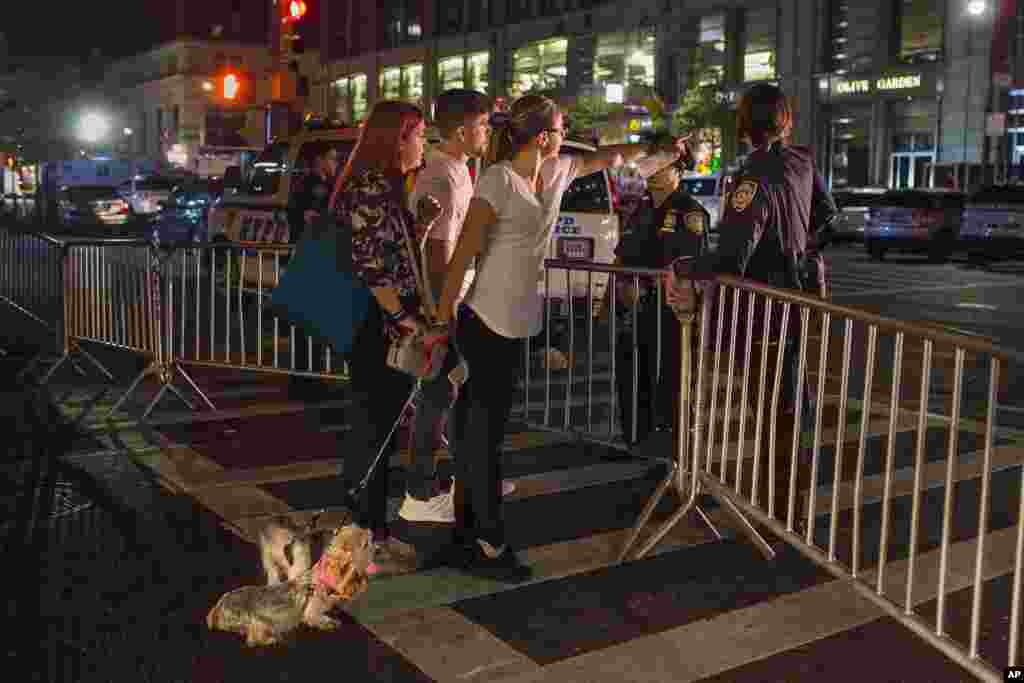 People try to access the area near the scene of an explosion on West 23rd Street and 6th Avenue in Manhattan&#39;s Chelsea neighborhood in New York, Sept. 18, 2016.