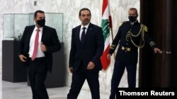 Lebanese Sunni leader Saad al-Hariri, walks after being named Lebanon's new prime minister at the presidential palace in Baabda
