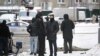 Investigators gather by a body at the blast scene, which killed Lieutenant General Igor Kirillov, and his assistant, according to the Russian Investigative Committee, in Moscow, Dec. 17, 2024. 