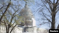FILE - The U.S. Capitol dome, currently under restoration, is seen in Washington April 11, 2015.