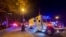 A Police truck is parked near the National Assembly of Quebec, in Quebec City, Nov. 1, 2020, after two people were killed and five wounded by a sword-wielding suspect dressed in medieval clothing.