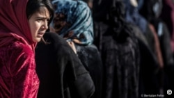 A young Iraqi girl at a camp outside Kirkuk for civilians displaced by the conflict against Islamic State. Photograph by Bertalan Feher, 2016.