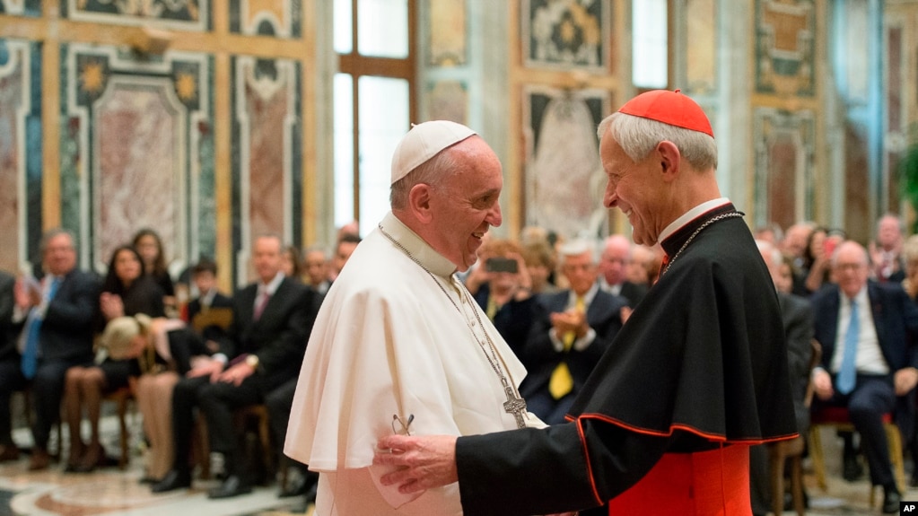 FILE -Pope Francis (L) talks with Papal Foundation Chairman Cardinal Donald Wuerl, Archbishop of Washington, D.C., during a meeting with members of the Papal Foundation at the Vatican, April 17, 2015. 