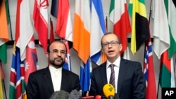 Iran's Ambassador to the IAEA, Reza Najafi, left, and IAEA Deputy Director General and Head of the Department of Safeguards, Tero Tapio Varjoranta, International Center, Vienna, Oct. 29, 2013.