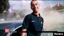 An undated frame grab from a France 2 video broadcast on March 21, 2012, which reportedly shows Mohamed Merah, the suspect in the 2012 killings of 3 paratroopers, 3 children and a rabbi in France.
