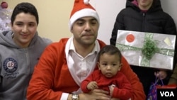 Mahmoud Mahmoud, the director of the Church World Service office in Jersey City, New Jersey, played Santa for a gathering of nearly 40 refugee children.