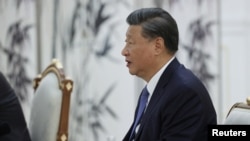 Chinese President Xi Jinping talks to Russian President Vladimir Putin during a meeting on the sidelines of the Shanghai Cooperation Organization (SCO) summit in Samarkand, Uzbekistan September 15, 2022. Sputnik/Alexandr Demyanchuk/Pool via REUTERS