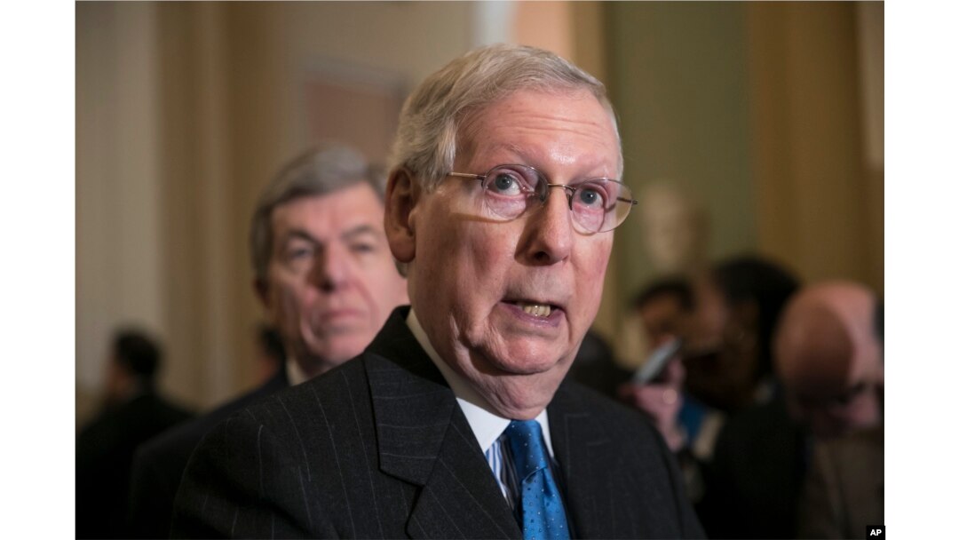 Senate Majority Leader Mitch McConnell, R-Ky., joined at left by Sen. Roy Blunt, R-Mo., speaks after a strategy session, at the Capitol in Washington, Dec. 11, 2018.