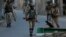 Indian paramilitary soldiers return to their base camp as they lift restrictions in Srinagar, Indian controlled Kashmir, July 8, 2018. 