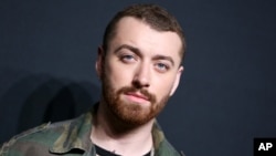 FILE - Sam Smith arrives at Saint Laurent at the Palladium at the Hollywood Palladium in Los Angeles.