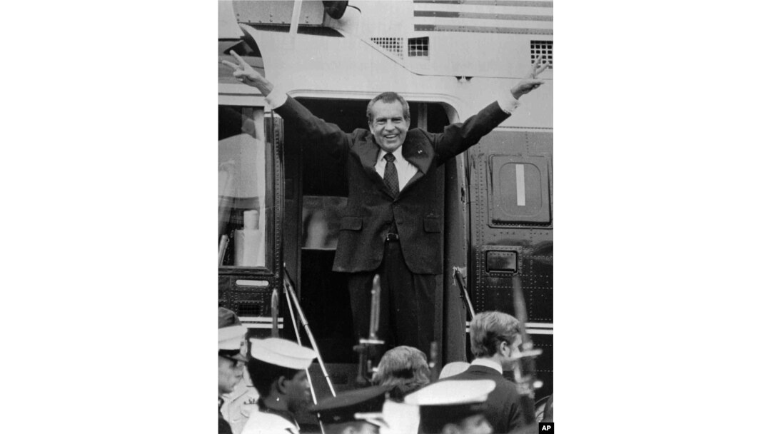 In this Aug. 9, 1974, file photo, Richard Nixon says goodbye to members of his staff outside the White House in Washington as he boards a helicopter for Andrews Air Force Base after resigning the presidency in Washington.