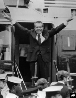In this Aug. 9, 1974, file photo, Richard Nixon says goodbye to members of his staff outside the White House in Washington as he boards a helicopter for Andrews Air Force Base after resigning the presidency in Washington.