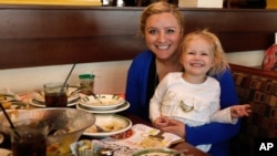 Cailyn Pierson and her mother visit Olive Garden in Naperville, Ill., on Take Our Daughters and Sons to Work Day in this photo distrubuted by the Olive Garden, April 25, 2013.
