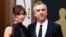 Mexican director Alfonso Cuaron, best director nominee for his film "Gravity," and his partner Sheherazade Goldsmith arrive at the 86th Academy Awards in Hollywood, California, March 2, 2014. 