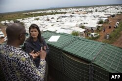 US Ambassador to the UN, Nikki Haley talks with a UN official during her visit at the UN Protection of Civilians (PoC) site in Juba, South Sudan, October 25, 2017.