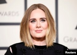 FILE - Singer Adele arrives at the 58th Grammy Awards in Los Angeles, Feb. 15, 2016.