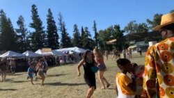 People run as an active shooter was reported at the Gilroy Garlic Festival, south of San Jose, California.