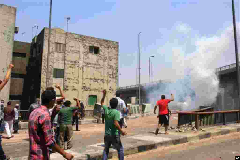 Supporters of Egypt's ousted President Morsi clash with security forces near the largest sit-in by supporters of Morsi.