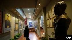 A Chinese visitor looking at exhibits at a memorial in Harbin, northeastern China's Heilongjiang province, to honor Ahn Jung-Geun, Jan. 19, 2014.