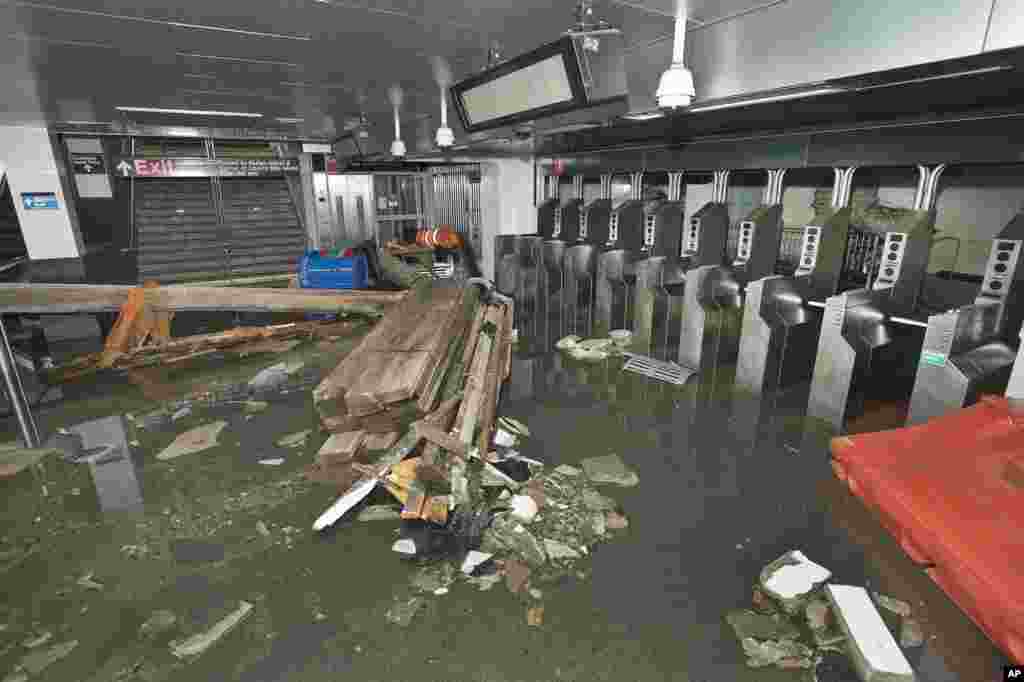 This photo provided by the Metropolitan Transportation Authority shows the South Ferry subway station after it was flooded by seawater during superstorm Sandy on Oct. 30, 2012. 