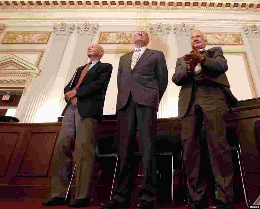 Apollo 11 astronauts Neil Armstrong, Michael Collins (L) and Buzz Aldrin (R) stand during a recognition ceremony at the U.S House of Representatives Committee on Science and Technology tribute to the Apollo 11 astronauts at the Cannon House Office Buildin