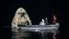 Support teams work around the SpaceX Crew Dragon Resilience spacecraft shortly after it landed with NASA astronauts Mike Hopkins, Shannon Walker, and Victor Glover, and Japan Aerospace Exploration Agency (JAXA) astronaut Soichi Noguchi aboard in the Gulf of Mexico off the coast of Panama City, Florida.