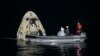 Support teams work around the SpaceX Crew Dragon Resilience spacecraft shortly after it landed with NASA astronauts Mike Hopkins, Shannon Walker, and Victor Glover, and Japan Aerospace Exploration Agency (JAXA) astronaut Soichi Noguchi aboard in the Gulf of Mexico off the coast of Panama City, Florida.