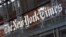 FILE - A sign for The New York Times hangs above the entrance to its building on May 6, 2021, in New York. The Times filed a federal lawsuit against OpenAI and Microsoft on Dec. 27, 2023, seeking to end the practice of using its published material to train chatbots.
