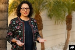 FILE - California Assemblywoman Cristina Garcia poses for a picture at her campaign headquarters in Downey, Calif., April 27, 2018. The California Legislature is resuming an investigation into allegations of misconduct by Garcia in light of concerns raised by the initial investigation.