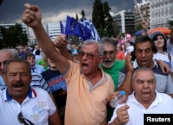 Pro-Euro protesters attend a rally in front of the parliament building, in Athens, Greece, June 30, 2015.