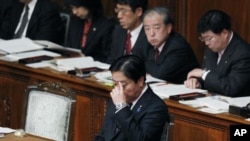 Japanese Prime Minister Yoshihiko Noda is seated after delivering his policy speech at the opening of the ordinary diet session at parliament in Tokyo, January 24, 2012.