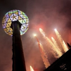 Fireworks go off as the New Year's Eve ball is raised for the celebration in Times Square last year