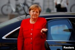 German Chancellor Angela Merkel arrives for a coalition meeting with the CSU and the SPD parties at the Reichstag in Berlin, Germany, July 5, 2018.