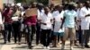 FILE: A group of Zimbabwean doctors protest at Parirenyatwa Hospital in Harare, Zimbabwe, Sunday, Sept. 15, 2019. 