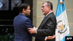 U.S. Secretary of State Marco Rubio, left, embraces Guatemalan President Bernardo Arevalo after a news conference at the Culture Palace in Guatemala City on Feb. 5, 2025.